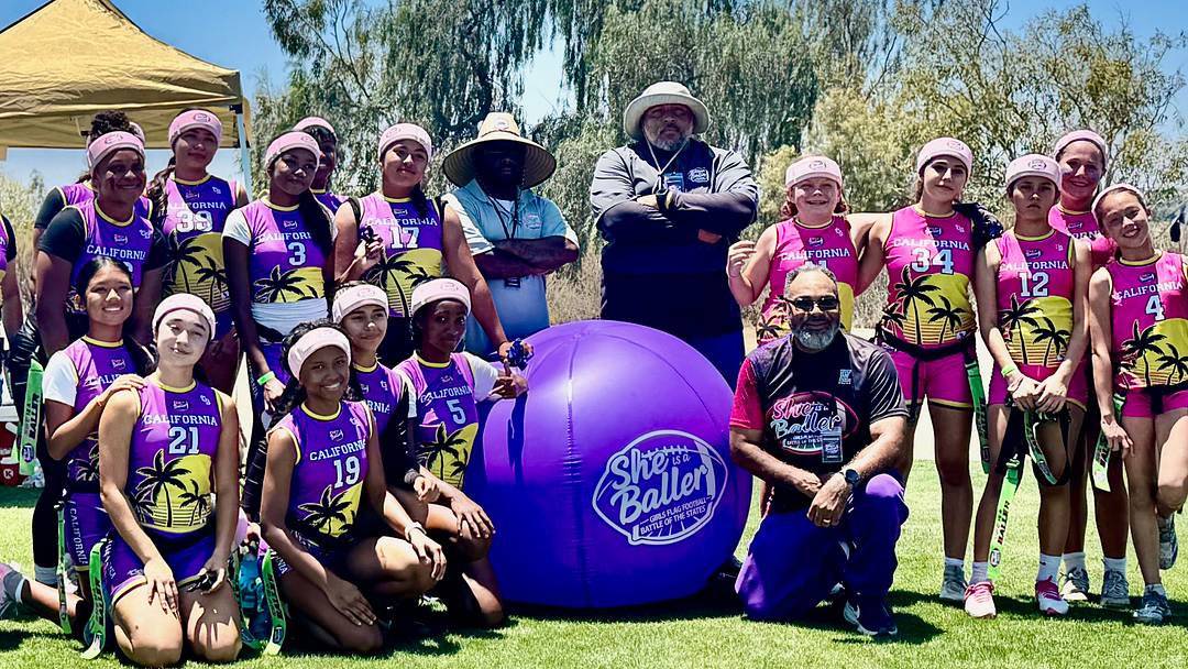 Girls Flag Football Athletes and Coaches from "She's A Baller" Tournament pose for a group photo.