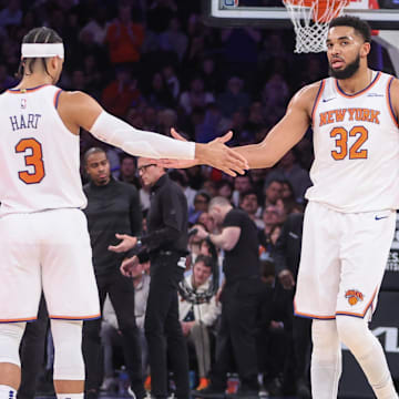 Feb 12, 2025; New York, New York, USA;  New York Knicks center Karl-Anthony Towns (32) is greeted by guard Josh Hart (3) during a timeout in the second quarter against the Atlanta Hawks at Madison Square Garden. Mandatory Credit: Wendell Cruz-Imagn Images