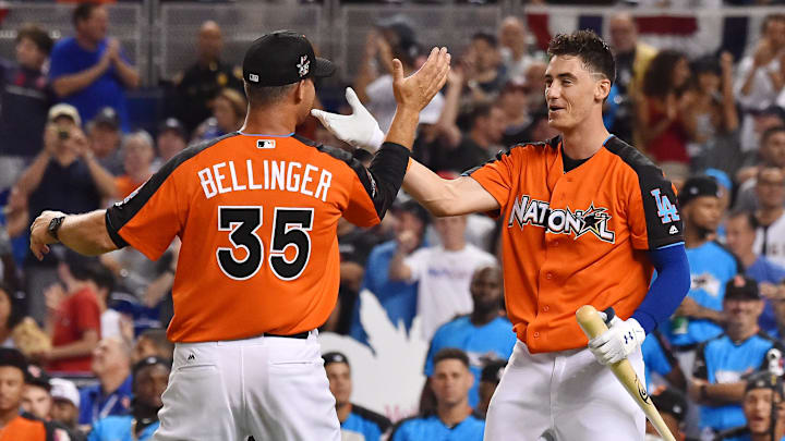 Cody Bellinger greets his father Clay Bellinger after the first round during the 2017 MLB Home Run Derby at Marlins Park.