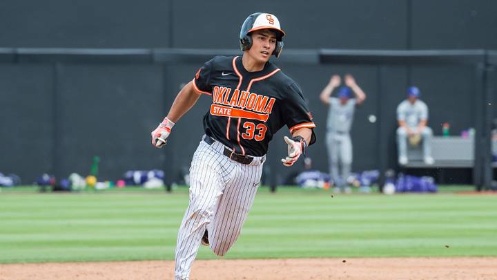 May 13, 2023; Stillwater, OK, USA;  Oklahoma State Cowboys catcher Chase Adkison (33) rounds second base after hitting a triple during the game against the Kansas State Wildcats at O'Brate Stadium. Mandatory Credit: Brett Rojo-Imagn Images