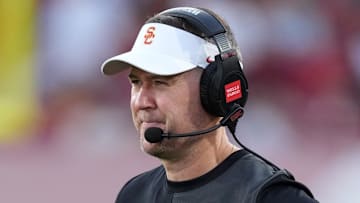 Aug 30, 2025; Los Angeles, California, USA; Southern California Trojans head coach Lincoln Riley watches from the sidelines against the Missouri State Bears in the first half at United Airlines Field at Los Angeles Memorial Coliseum. Mandatory Credit: Kirby Lee-Imagn Images