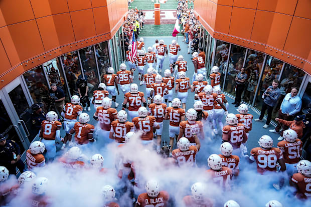The Longhorns take the field earlier this month.