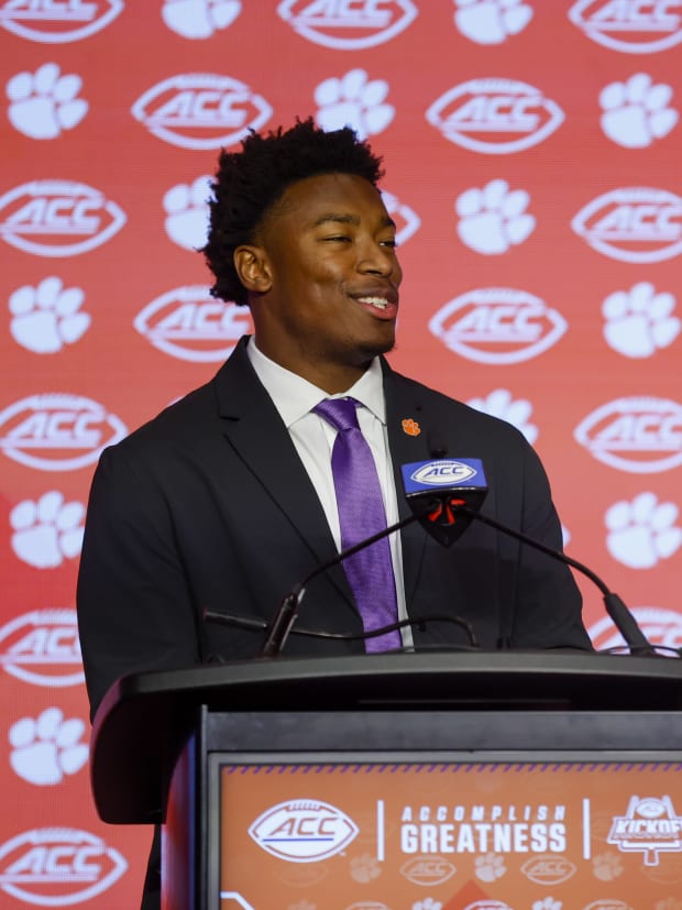 RJ Mickens stands behind the podium at the ACC Kickoff event.