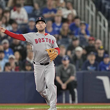 Apr 29, 2025; Toronto, Ontario, CAN; Boston Red Sox third baseman Alex Bregman (2) throws out Toronto Blue Jays left fielder Myles Straw (not pictured) at first base to end the seventh inning at Rogers Centre. Mandatory Credit: John E. Sokolowski-Imagn Images