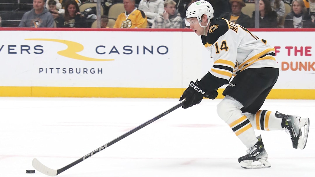 Mar 1, 2025; Pittsburgh, Pennsylvania, USA;  Boston Bruins defenseman Ian Mitchell (14) skates with the puck against the Pittsburgh Penguins during the third period at PPG Paints Arena. Mandatory Credit: Charles LeClaire-Imagn Images