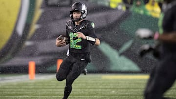Oregon quarterback Brock Thomas runs the ball as the Oregon Ducks host the Wisconsin Badgers on Oct. 25, 2025, at Autzen Stadium in Eugene, Oregon.