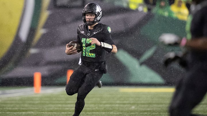 Oregon quarterback Brock Thomas runs the ball as the Oregon Ducks host the Wisconsin Badgers on Oct. 25, 2025, at Autzen Stadium in Eugene, Oregon.