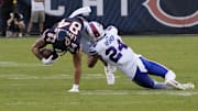 Colston Loveland makes a catch and is dragged down against the Bills.
