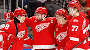 Oct 19, 2025; Detroit, Michigan, USA;  Detroit Red Wings center Dylan Larkin (71) celebrates with his teammates after scoring a goal against the Edmonton Oilers during the second period at Little Caesars Arena. Mandatory Credit: Rick Osentoski-Imagn Images