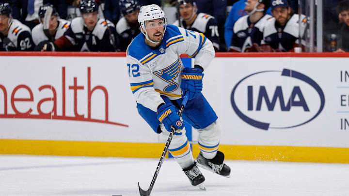 Dec 31, 2025; Denver, Colorado, USA; St. Louis Blues defenseman Justin Faulk (72) controls the puck in the third period against the Colorado Avalanche at Ball Arena. Mandatory Credit: Isaiah J. Downing-Imagn Images