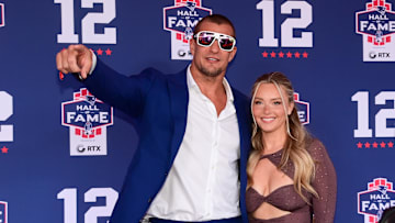 Jun 12, 2024; Foxborough, MA, USA; Retired NFL tight end Rob Gronkowski poses for photos with his girlfriend Camille Kostek during the New England Patriots Hall of Fame induction Ceremony for Tom Brady Mandatory Credit: Eric Canha-Imagn Images