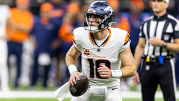 Oct 17, 2024; New Orleans, Louisiana, USA;  Denver Broncos quarterback Bo Nix (10) looks to pas downfield against the New Orleans Saints during the first half at Caesars Superdome. Mandatory Credit: Stephen Lew-Imagn Images
