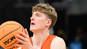 Mar 20, 2025; Milwaukee, WI, USA; Illinois Fighting Illini guard Kasparas Jakucionis (32) shoots the ball during NCAA Tournament First Round Practice at Fiserv Forum. Mandatory Credit: Benny Sieu-Imagn Images