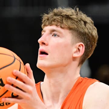Mar 20, 2025; Milwaukee, WI, USA; Illinois Fighting Illini guard Kasparas Jakucionis (32) shoots the ball during NCAA Tournament First Round Practice at Fiserv Forum. Mandatory Credit: Benny Sieu-Imagn Images