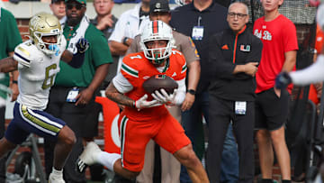 Nov 9, 2024; Atlanta, Georgia, USA; Miami Hurricanes wide receiver Xavier Restrepo (7) catches a pass for a touchdown against the Georgia Tech Yellow Jackets in the fourth quarter at Bobby Dodd Stadium at Hyundai Field. Mandatory Credit: Brett Davis-Imagn Images