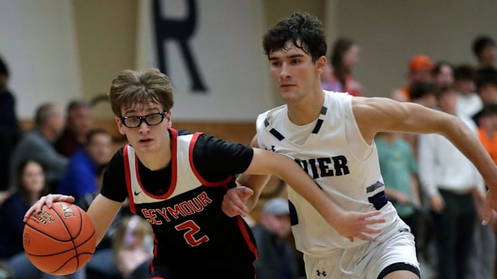 Seymour High School's Teage Cornell (2) gets past Xavier High School's Kyler Bleck (3) during their boys basketball game Tuesday, December 9, 2025, in Appleton, Wisconsin. Seymour won 82-69. Seymour High School's Teage Cornell (2) gets past Xavier High School's Kyler Bleck (3) during their boys basketball game Tuesday, December 9, 2025, in Appleton, Wisconsin. Seymour won 82-69.