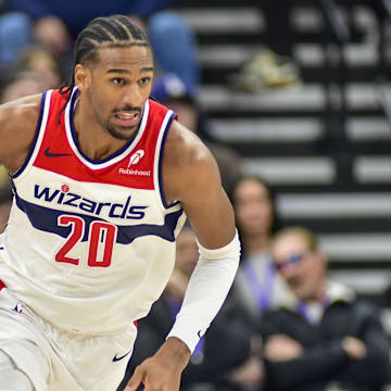 Mar 19, 2025; Salt Lake City, Utah, USA;  Washington Wizards center Alex Sarr (20) make a breakaway against the Utah Jazz during the first half at the Delta Center. Mandatory Credit: Peter Creveling-Imagn Images