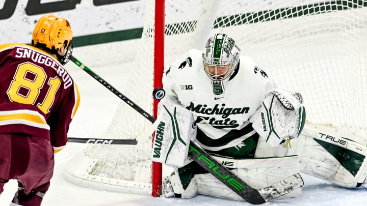 Michigan State's Trey Augustine, right, stops a goal attempt by Minnesota's Jimmy Snuggerud during the first period on Friday, Jan. 26, 2024, at Munn Arena in East Lansing.