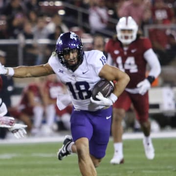 Jack Bech stiff arms a Stanford defender on his way to a 100-yard game. 