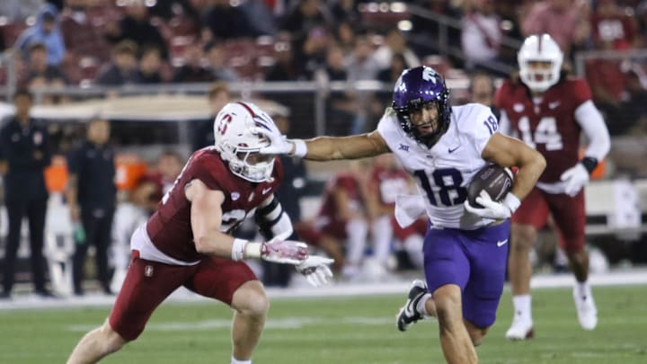 Jack Bech stiff arms a Stanford defender on his way to a 100-yard game. 