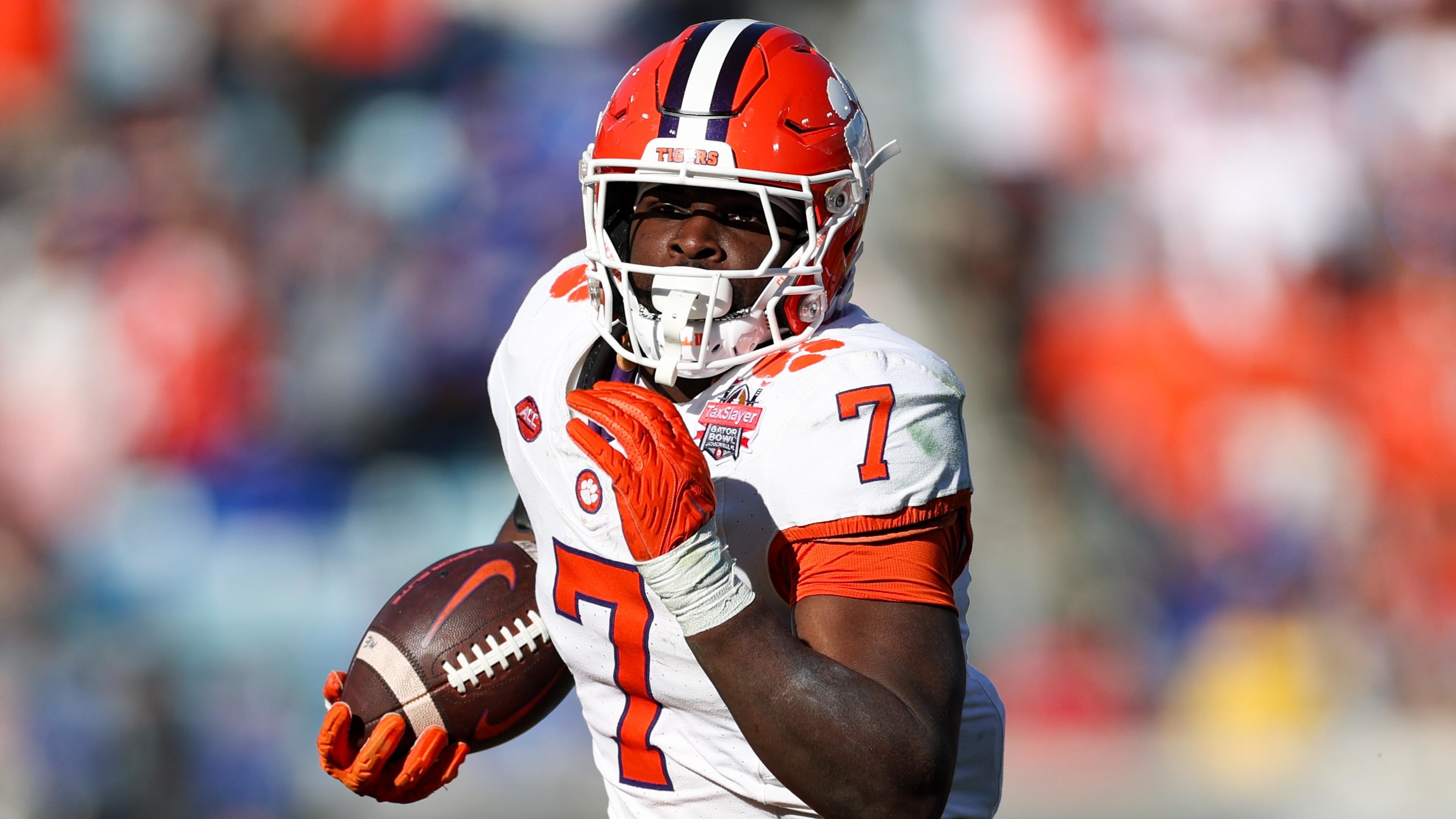 Clemson Tigers running back Phil Mafah on a rushing attempt during a college football game in the ACC.