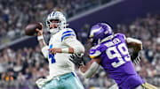 Dallas Cowboys quarterback Dak Prescott throws over Minnesota Vikings linebacker Danielle Hunter