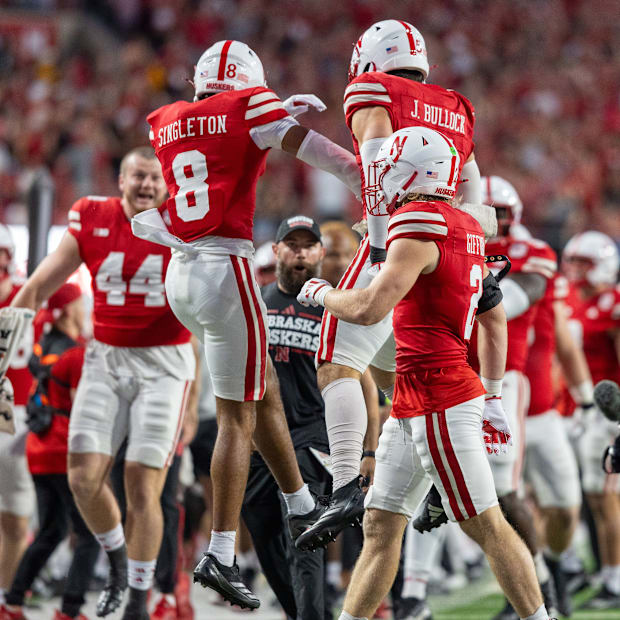 Nebraska defenders DeShon Singleton and John Bullock celebrate after Bullock forced a fumble that Singleton recovered.
