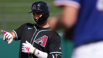 Arizona Diamondbacks' Jordan Lawlar (10) celebrates his RBI double against the Texas Rangers at Surprise Stadium on Sunday, March 2, 2025.