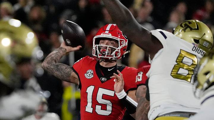 Georgia quarterback Carson Beck (15) throws the ball during the first half of a NCAA college football game against Georgia Tech in Athens, Ga., on Friday, Nov. 29, 2024.