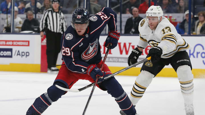 Nov 27, 2023; Columbus, Ohio, USA; Columbus Blue Jackets right wing Patrik Laine (29) controls the puck as Boston Bruins center Charlie Coyle (13) trails the play during the second period at Nationwide Arena. Mandatory Credit: Russell LaBounty-USA TODAY Sports