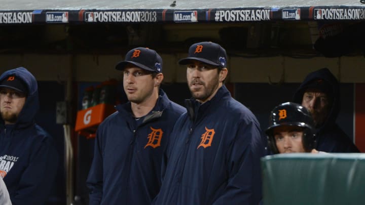 October 10, 2013; Oakland, CA, USA; Detroit Tigers starting pitcher Max Scherzer (37, left) and starting pitcher Justin Verlander (35, right) stand in the dugout during the ninth inning in game five of the American League divisional series playoff baseball game against the Oakland Athletics at O.co Coliseum. The Tigers defeated the Athletics 3-0.