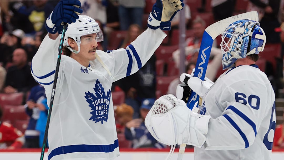 Dec 2, 2025; Sunrise, Florida, USA; Toronto Maple Leafs defenseman Philippe Myers (51) celebrates with goaltender Joseph Woll (60) after the game against the Florida Panthers at Amerant Bank Arena. Mandatory Credit: Sam Navarro-Imagn Images