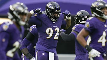 Dec 10, 2023; Baltimore, Maryland, USA;  Baltimore Ravens defensive tackle Justin Madubuike (92) celebrates a sack against the Los Angeles Rams during the first quarter at M&T Bank Stadium. Mandatory Credit: Jessica Rapfogel-Imagn Images