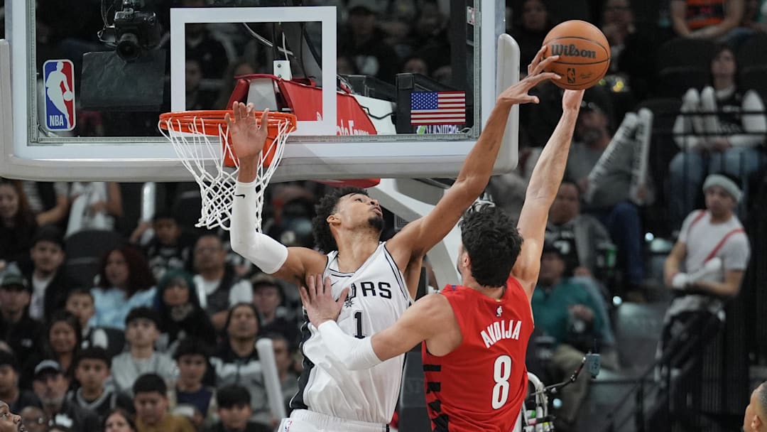 San Antonio Spurs center Victor Wembanyama (1) blocks a shot by Portland Trail Blazers forward Deni Avdija (8) in the second half at Frost Bank Center. 