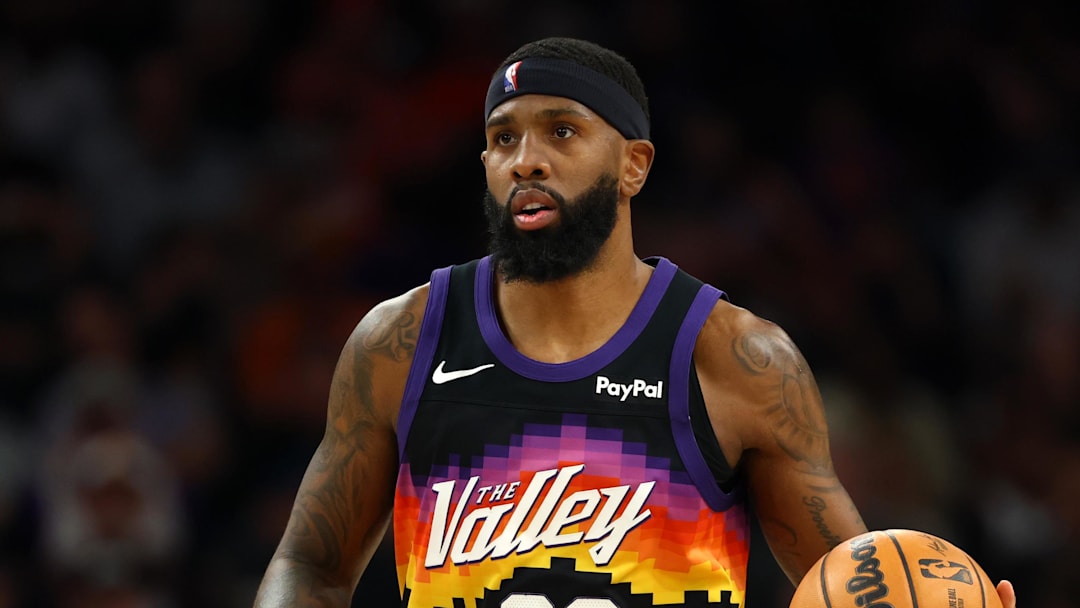 Feb 21, 2026; Phoenix, Arizona, USA; Phoenix Suns forward Royce O'Neale (00) against the Orlando Magic at Mortgage Matchup Center. Mandatory Credit: Mark J. Rebilas-Imagn Images