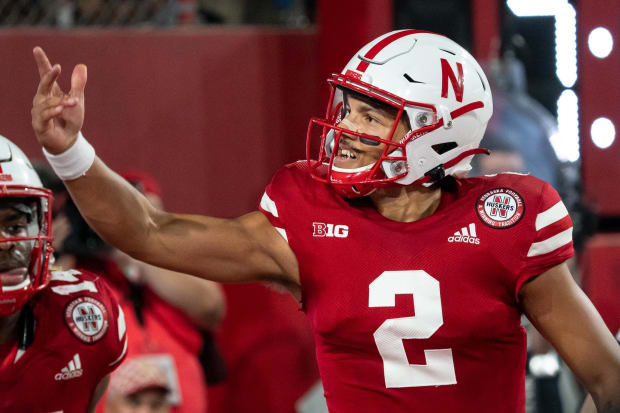 Nebraska Cornhuskers quarterback Adrian Martinez pumps up the crowd after a touchdown against the Michigan Wolverines in 