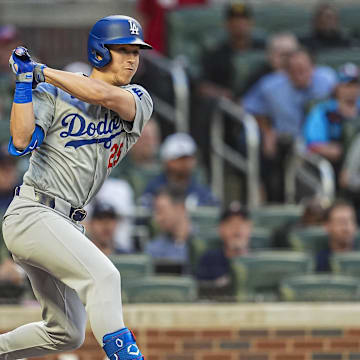  Los Angeles Dodgers shortstop Tommy Edman (25) hits a double against the Atlanta Braves during the second inning at Truist Park on Sept 15.