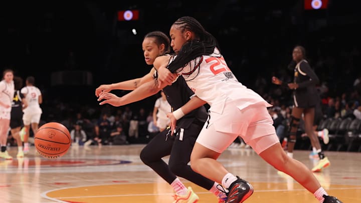 Apr 1, 2025; Brooklyn, NY, USA; McDonald's All American East guard Mia Pauldo (3) and McDonald's All American West guard Aliyahna Morris (25) compete for the ball during the first half of the game at Barclays Center. Mandatory Credit: Pamela Smith-Imagn Images