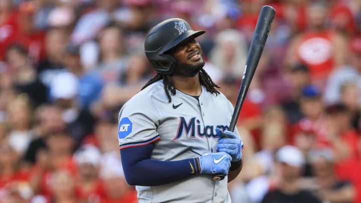 Jul 12, 2024; Cincinnati, Ohio, USA; Miami Marlins first baseman Josh Bell (9) reacts after striking out in the second inning against the Cincinnati Reds at Great American Ball Park.