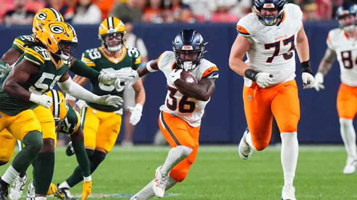 Aug 18, 2024; Denver, Colorado, USA; Denver Broncos running back Tyler Badie (36) carries the ball in the third quarter at Empower Field at Mile High. Mandatory Credit: Ron Chenoy-USA TODAY Sports