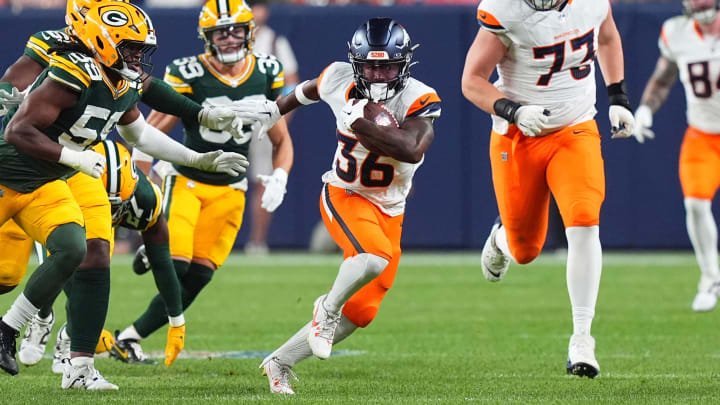 Aug 18, 2024; Denver, Colorado, USA; Denver Broncos running back Tyler Badie (36) carries the ball in the third quarter at Empower Field at Mile High. Mandatory Credit: Ron Chenoy-USA TODAY Sports