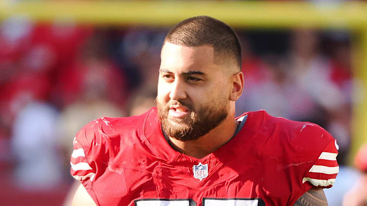 San Francisco 49ers offensive lineman Dominick Puni (77)