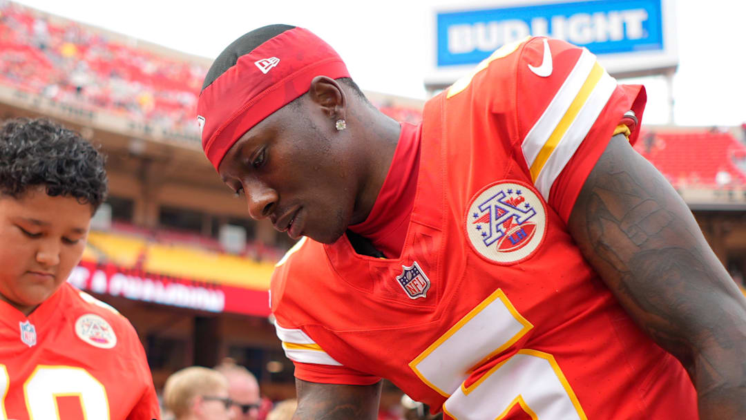 Sep 14, 2025; Kansas City, Missouri, USA; Kansas City Chiefs wide receiver Hollywood Brown (5) signs an autograph prior to the game against the Philadelphia Eagles at GEHA Field at Arrowhead Stadium. Mandatory Credit: Jay Biggerstaff-Imagn Images