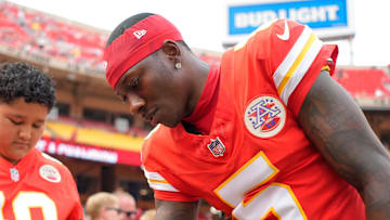 Sep 14, 2025; Kansas City, Missouri, USA; Kansas City Chiefs wide receiver Hollywood Brown (5) signs an autograph prior to the game against the Philadelphia Eagles at GEHA Field at Arrowhead Stadium. Mandatory Credit: Jay Biggerstaff-Imagn Images