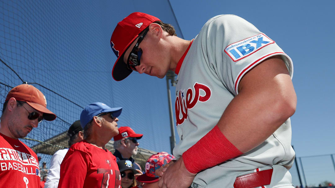 Mar 2, 2025; Dunedin, Florida, USA; Philadelphia Phillies infielder Aidan Miller (81) signs autographs for fans before a game against the Toronto Blue Jays during spring training at TD Ballpark. Mar 2, 2025; Dunedin, Florida, USA; Philadelphia Phillies infielder Aidan Miller (81) signs autographs for fans before a game against the Toronto Blue Jays during spring training at TD Ballpark.