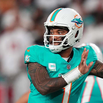 Dec 22, 2024; Miami Gardens, Florida, USA; Miami Dolphins quarterback Tua Tagovailoa (1) attempts a pass against the San Francisco 49ers during second half at Hard Rock Stadium. 