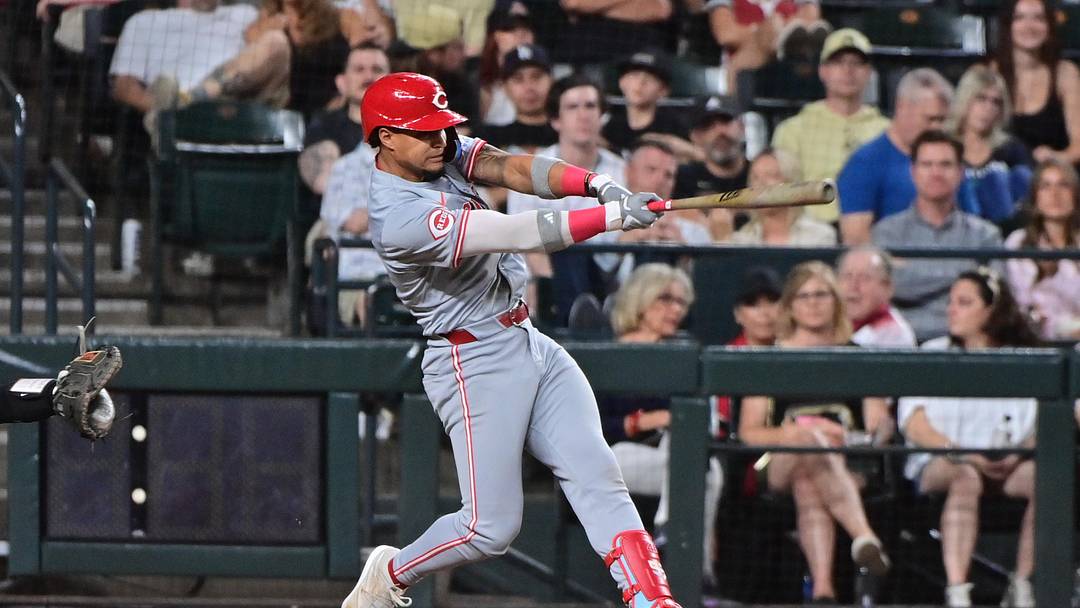 May 14, 2024; Phoenix, Arizona, USA; Cincinnati Reds second baseman Santiago Espinal (4) hits a RBI