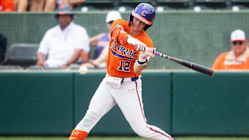 Clemson's Cooper Ingle (12) swings at a pitch during a NCAA baseball regional game between Clemson and Charlotte held at Doug Kingsmore Stadium in Clemson, S.C., on Sunday, June 4, 2023.