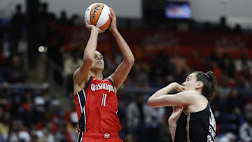 Elena Delle Donne shoots over Breanna Stewart in 2023.