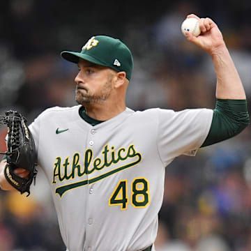 Apr 20, 2025; Milwaukee, Wisconsin, USA; Athletics relief pitcher T.J. McFarland (48) pitches during the sixth inning against the Milwaukee Brewers at American Family Field. Mandatory Credit: Patrick Gorski-Imagn Images